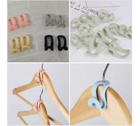 24 ganchos de conexión que ahorran espacio, para perchas de plástico. Reutilizables y ligeros, ideales para organizar la ropa. 24 unidades, color aleatorio, para el armario