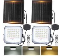 Aigostar - Foco proyector LED solar con mando a distancia,4000mAH,gran panel solar y batería de gran capacidad,regulable 3000/4000/6500K,Función crepuscular,Luz solar para exterior y jardín,2 piezas.