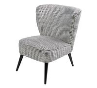 Butaca de terciopelo con motivos decorativos en blanco y negro