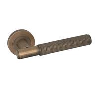 Micel - 00346 - Juego de manilla con roseta (50 mm), maneta con textura, acabado Cuero, color bronce, 140 x 50 x 65 mm (Bronce)