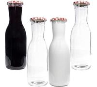 mikken 4 botellas de cristal de 1,0 litros con etiquetas.