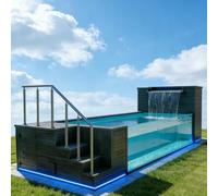 Piscina con panel lateral de cristal, piscina de contenedor de envío de 20 pies, piscina modular de lujo sobre el suelo con cascada y LED multicolor, característica de agua moderna para hoteles