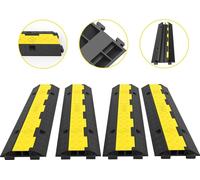 Rampa protectora para cables, paquete de 4 unidades, con 2 canales, tipo resaltado. Fabricada en goma modular, con capacidad de carga de 11000 libras. Ideal para proteger cables y cordones en entradas