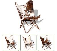 Sillón "Butterfly" de The Living Store, color marrón y blanco, tapizado en cuero de vaca genuino