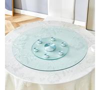 Tablero de cristal redondo de dos niveles. El diámetro superior del cristal es de 77 cm y la parte inferior de 38 cm. El diseño giratorio permite una fácil recogida y colocación de objetos.